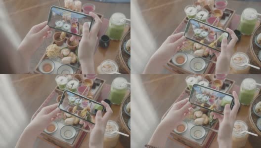 一名女子拍下她的食物并分享到社交媒体上高清在线视频素材下载