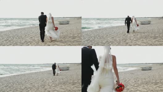 一对情侣在海滩上散步高清在线视频素材下载