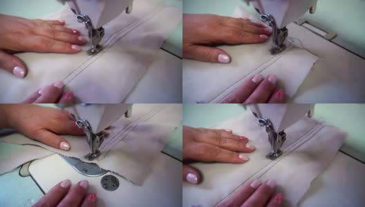 中年妇女在米色织物缝纫机上手工缝制高清在线视频素材下载