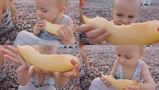 小男孩在海滩上吃瓜高清在线视频素材下载