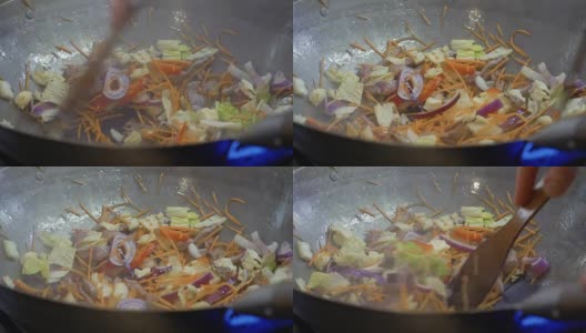 厨师在热锅里拌炒蔬菜高清在线视频素材下载