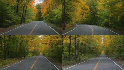 4K视频的汽车驾驶在山区森林道路在秋天，魁北克，加拿大高清在线视频素材下载