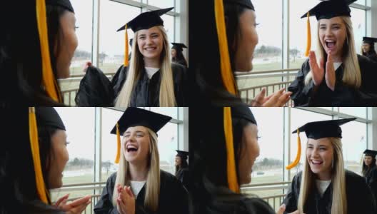 欣喜若狂的女高中毕业生与朋友庆祝高清在线视频素材下载
