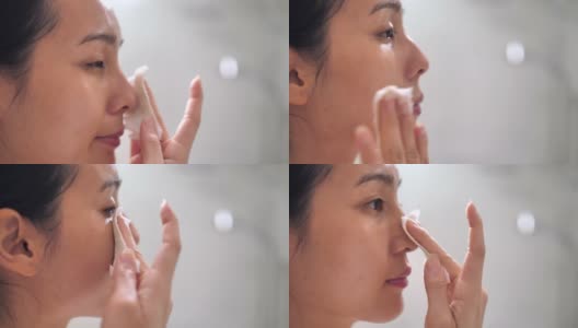 亚洲妇女在家里的浴室洗脸高清在线视频素材下载