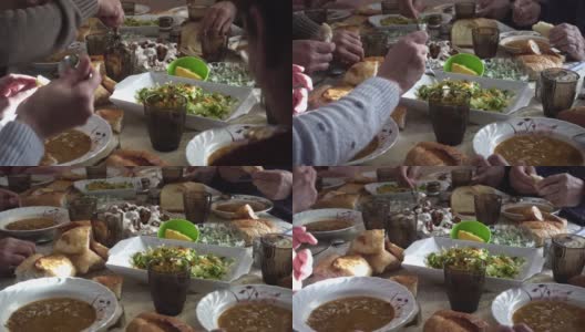 拥挤的穆斯林家庭在斋月的一天吃素食和开斋饭高清在线视频素材下载