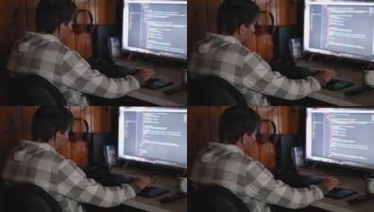 编程的概念。男程序员在电脑上工作，在家里编码，在屏幕上写代码。程序员IT工程师在项目中输入数据代码高清在线视频素材下载