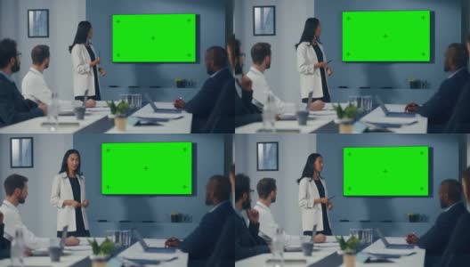 办公室会议室会议报告:积极的女性数字企业家谈话，使用绿色屏幕彩色键墙电视。成功地向投资者展示产品。慢动作高清在线视频素材下载