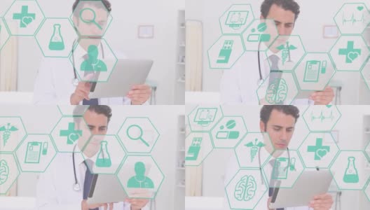 数字组成的多个医疗图标对抗白人男性医生使用数字平板电脑高清在线视频素材下载