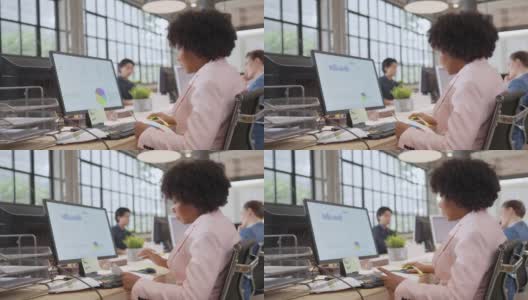 白人女商人在现代办公室工作，具有开朗和快乐的积极思维，有吸引力的创造性女性在办公室使用电脑和纸财务图表业务分析高清在线视频素材下载
