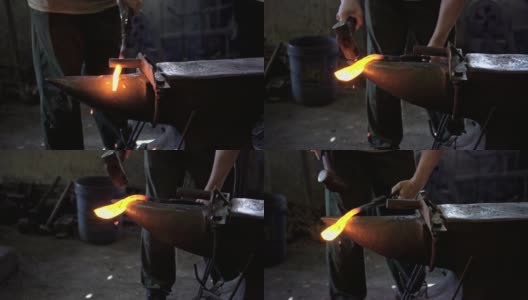 铁匠用锤子打铁高清在线视频素材下载