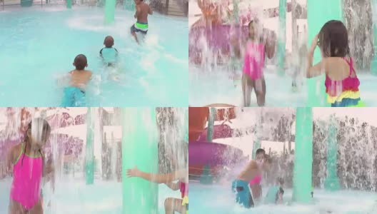 多民族儿童在水上乐园嬉戏，溅水花高清在线视频素材下载