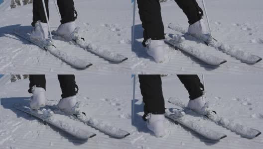 近距离女子滑雪者解开山滑雪靴使用棍棒高清在线视频素材下载