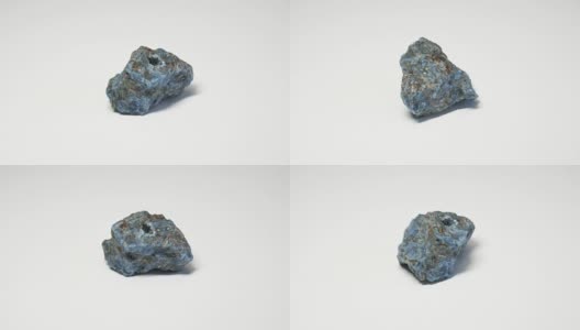 蓝色磷灰石在白色背景上旋转高清在线视频素材下载