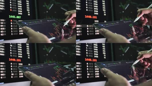 商人使用平板电脑分析股票市场高清在线视频素材下载