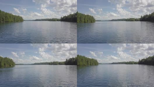 在一个半阴的日子里，空中飞过一条湖的水道高清在线视频素材下载