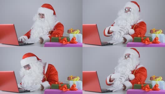 圣诞老人在电脑前工作，笑50帧/秒高清在线视频素材下载