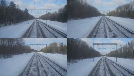 4K的视角从火车火车头。火车沿着积雪的小路行驶高清在线视频素材下载