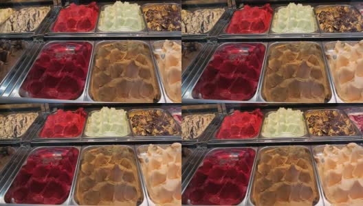 全景冰箱店，不同口味的冰淇淋躺在托盘里高清在线视频素材下载