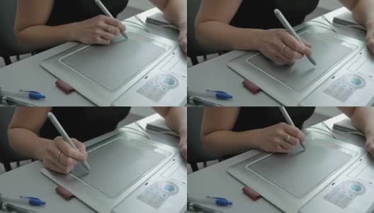 一名女子用笔、平板电脑、数字化仪和触控笔作画高清在线视频素材下载