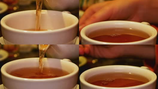 将红茶从茶壶中倒入杯中并搅拌高清在线视频素材下载