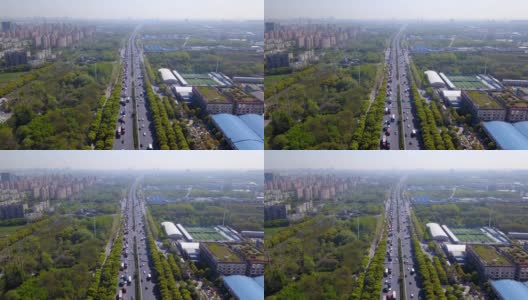 汽车在高速公路上直行城市的鸟瞰图。在建筑结构和交通理念上具有天然绿树的桥梁或道路。前视图。城市城市，中国上海。高清在线视频素材下载