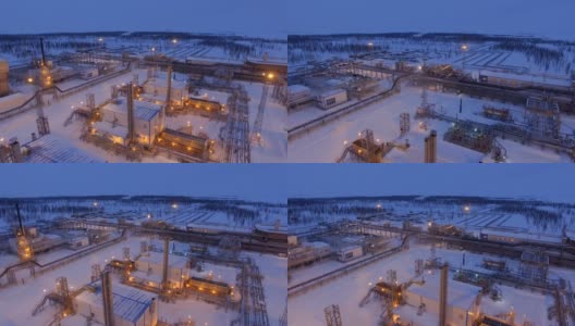 冬季夜晚在燃气厂区域上空飞行高清在线视频素材下载