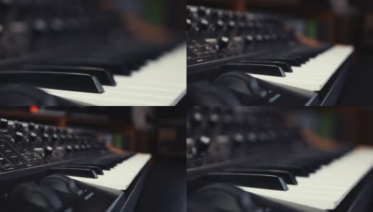 模拟合成器钢琴键盘视频剪辑。Dj商店出售专业的midi控制器设备与黑白键。高清在线视频素材下载