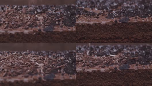 在巧克力蛋糕上撒上巧克力屑。极端特写镜头高清在线视频素材下载