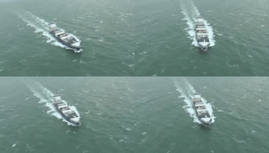 鸟瞰图货船驶离海岸高清在线视频素材下载