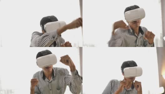 男人戴VR眼镜打拳击游戏高清在线视频素材下载