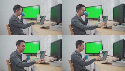 年轻的资讯科技人员使用多台绿屏电脑工作高清在线视频素材下载