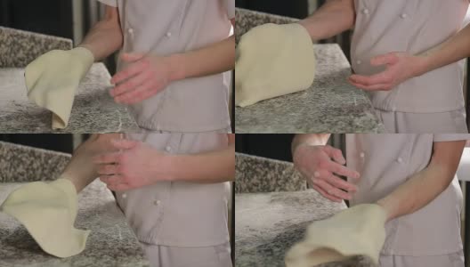厨师搅拌披萨面团。熟练的厨师准备一个披萨高清在线视频素材下载