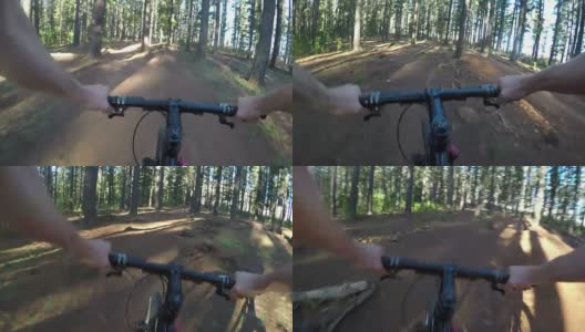 骑山地自行车穿过森林高清在线视频素材下载
