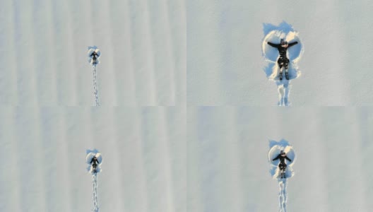 顶部鸟瞰图的年轻快乐微笑的女孩使手臂雪天使的形象和躺在雪，冬季户外活动高清在线视频素材下载