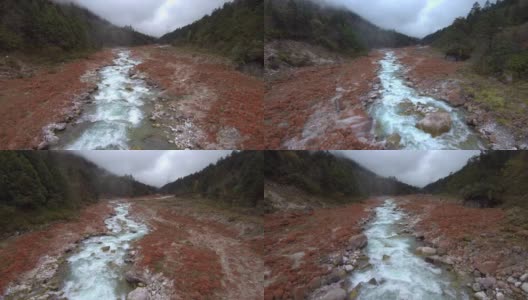 无人机拍摄的小溪流穿过红石国家公园，靠近四川磨溪镇高清在线视频素材下载
