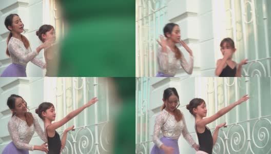 在泰国曼谷，一名亚洲青少年芭蕾舞者在当地街道上练习芭蕾舞，年轻的女芭蕾舞教师。概念活泼的年轻妇女和孩子在周末的活动。高清在线视频素材下载