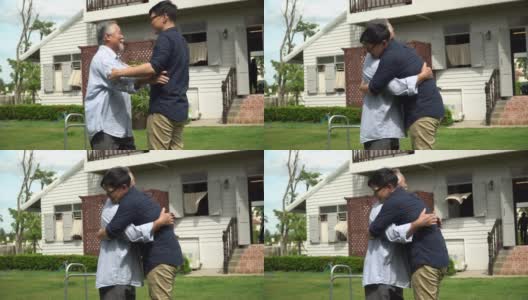 亚洲老人带着沃克和成年的儿子一起走在加登的家里。老人残疾行走和照顾年轻人帮助在后院。保健家庭生活方式高清在线视频素材下载