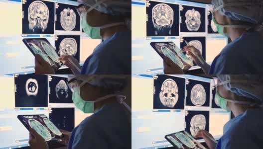 放射科医生使用计算机进行核磁共振扫描高清在线视频素材下载