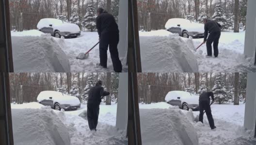 一场冬季暴风雪过后，一名男子正在清理车库和车道的出口。高清在线视频素材下载