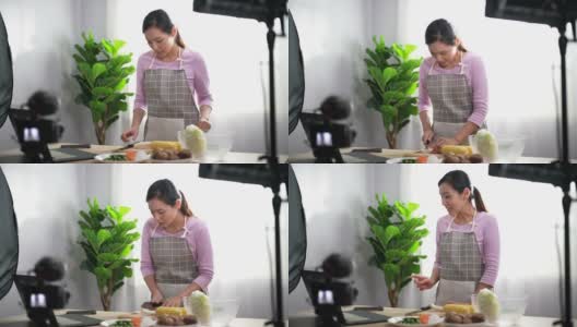 女厨师在网上举办的虚拟烹饪课上与观众交谈高清在线视频素材下载