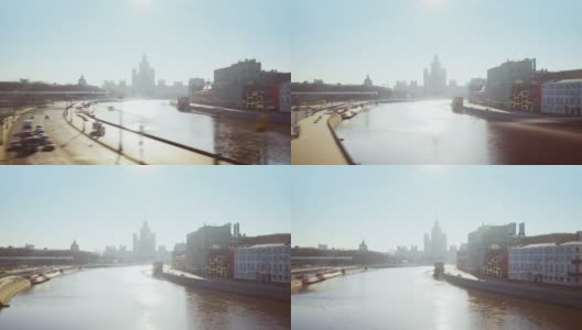 从莫斯科大桥上拍摄的春日清晨河上科特尔尼切斯卡亚河堤高清在线视频素材下载