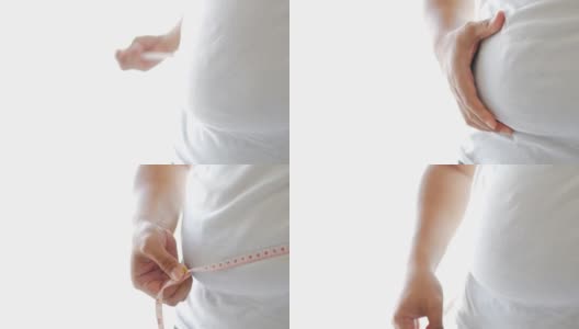 胖人用测量尺测量自己的肚子高清在线视频素材下载