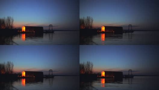 时光流逝，落日后的小工业码头在河边，水景优美高清在线视频素材下载