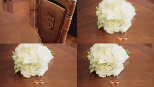 婚礼花束和结婚戒指摆在桌上高清在线视频素材下载