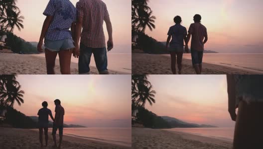 浪漫的情侣在迷人的夕阳下手牵着手漫步在沙滩上。幸福的年轻夫妇在旅游假期享受海洋日落。缓慢的运动。1920 x1080高清在线视频素材下载