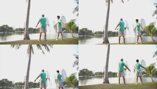 亚洲老夫妇以湖泊和城市公园为背景进行户外运动的视频。抽象热爱健康和自然高清在线视频素材下载