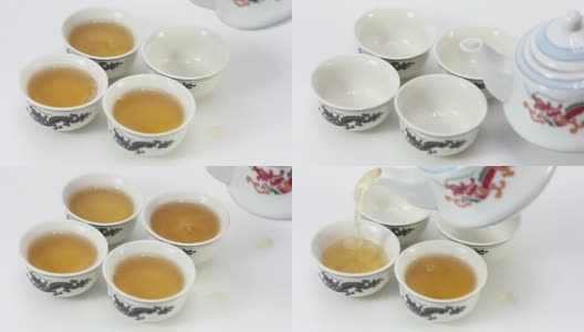 把茶从茶壶倒进茶杯里高清在线视频素材下载