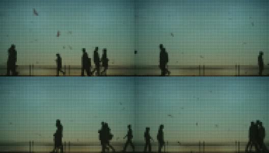 像素化的人类剪影在海边散步、慢跑和骑自行车高清在线视频素材下载