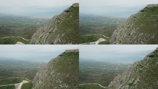 在希腊乡村的山上堡垒上空飞行高清在线视频素材下载
