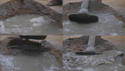 人把透明的水倒进水泥堆里高清在线视频素材下载